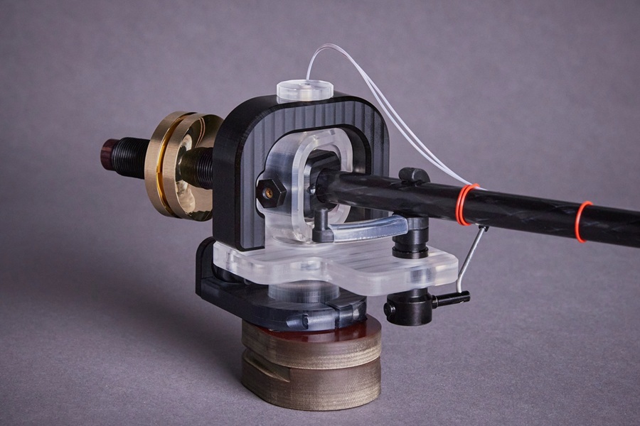 The tonearm is slightly to the left when viewed from the front